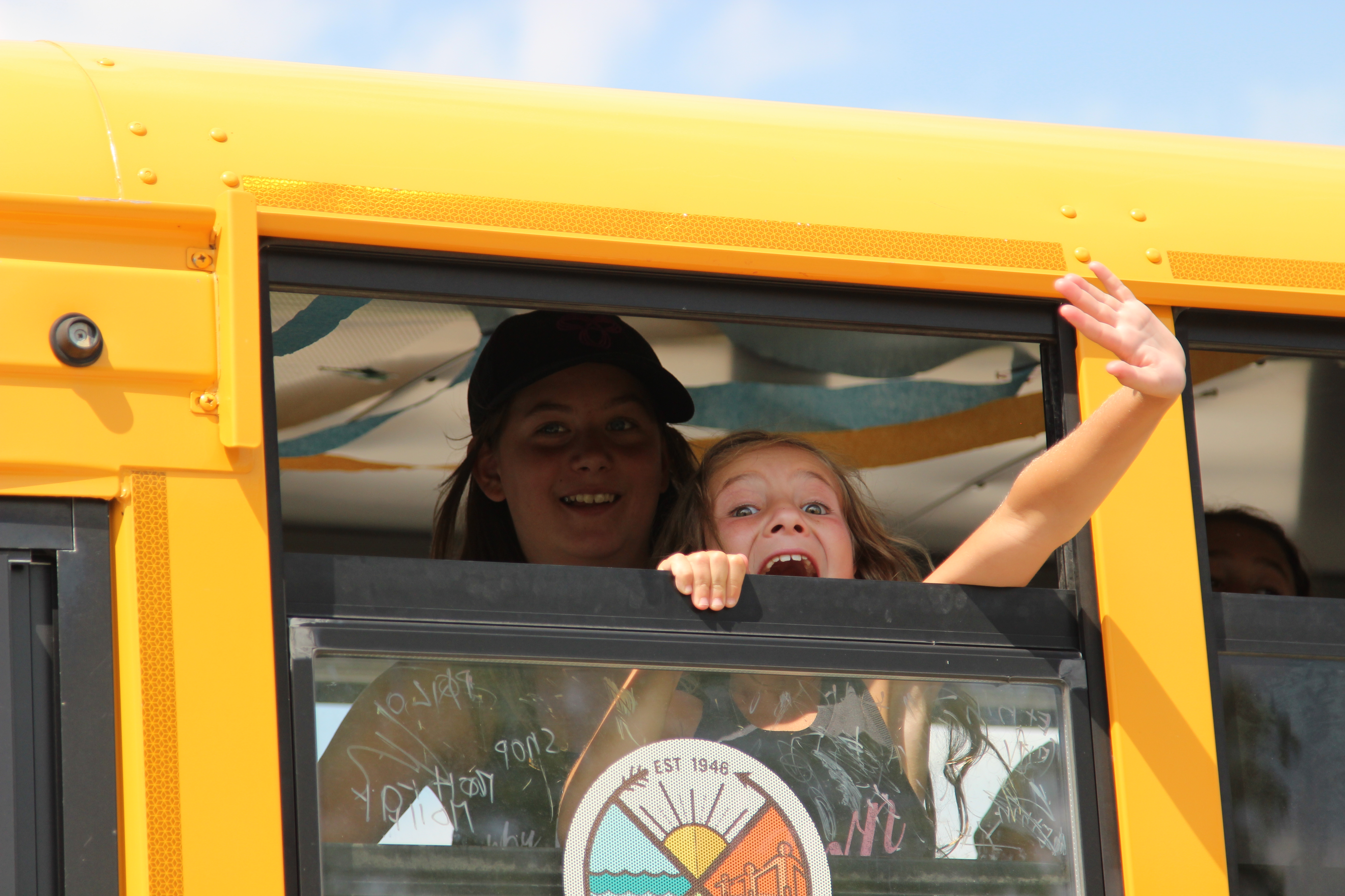 Waving goodbye from the Camp Robin Hood bus. Camp Robin Hood is Canada's oldest and largest day camp.
