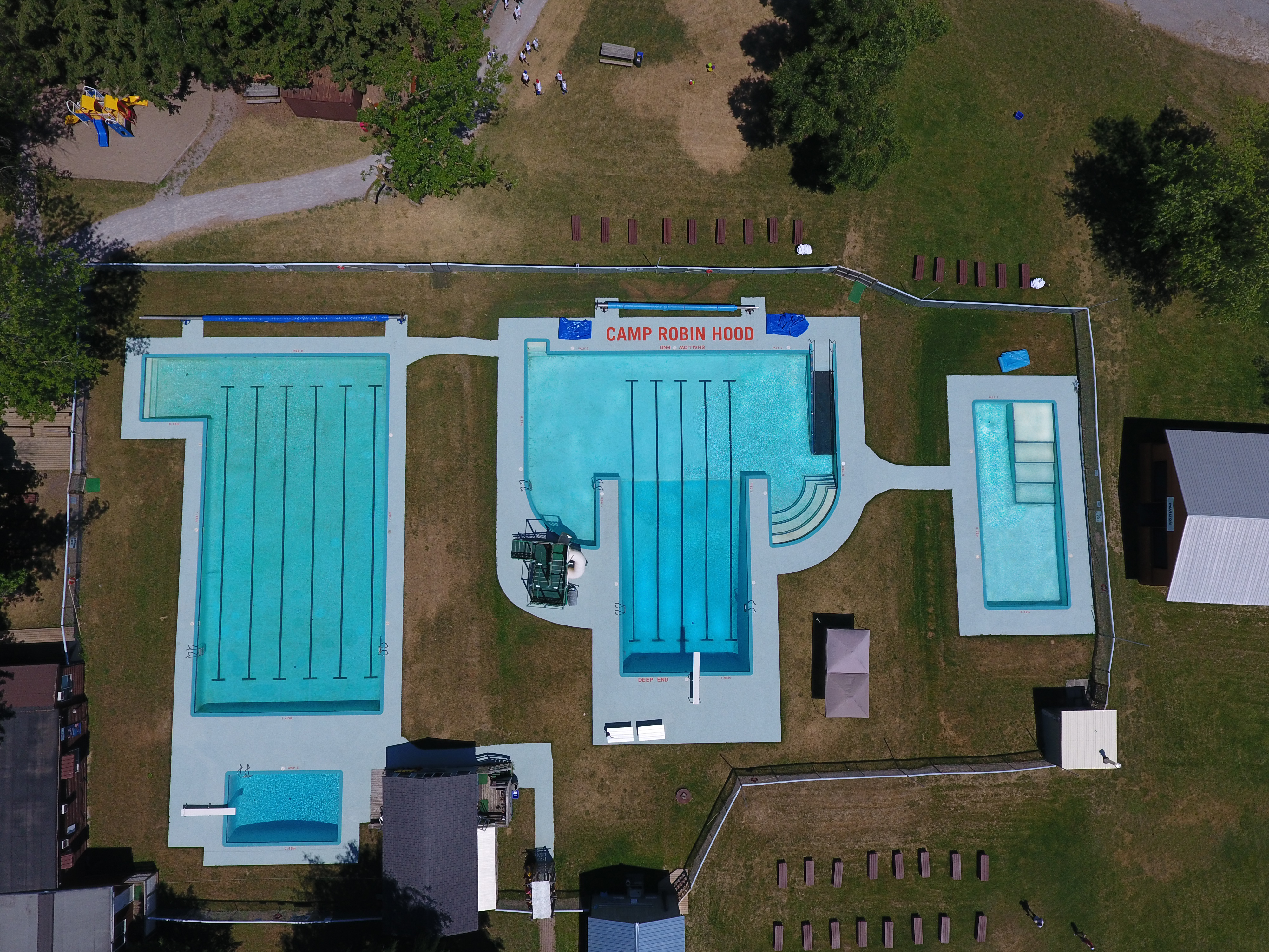Aerial Photo of 4 heated swimming pools at the oldest and largest day camp in Canada, Camp Robin Hood