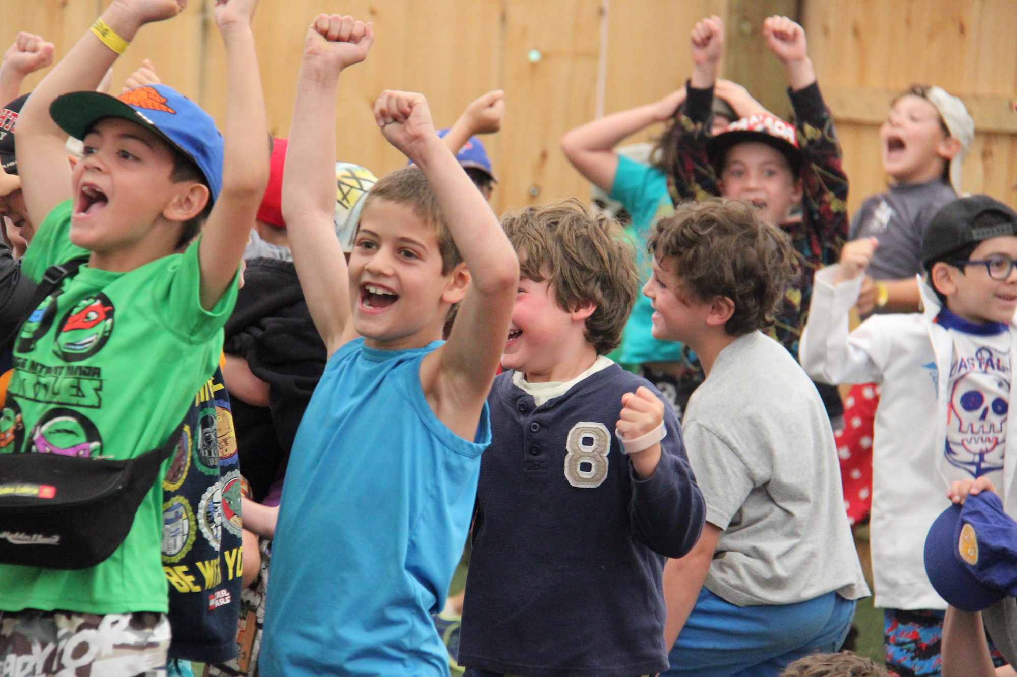 Kids cheering with excitement at Camp Robin Hood
