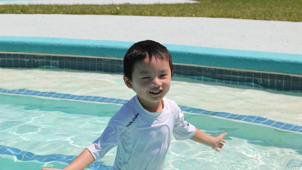 A new swimmer tries out the transitional steps in one of the 4 pools at Camp Robin Hood.