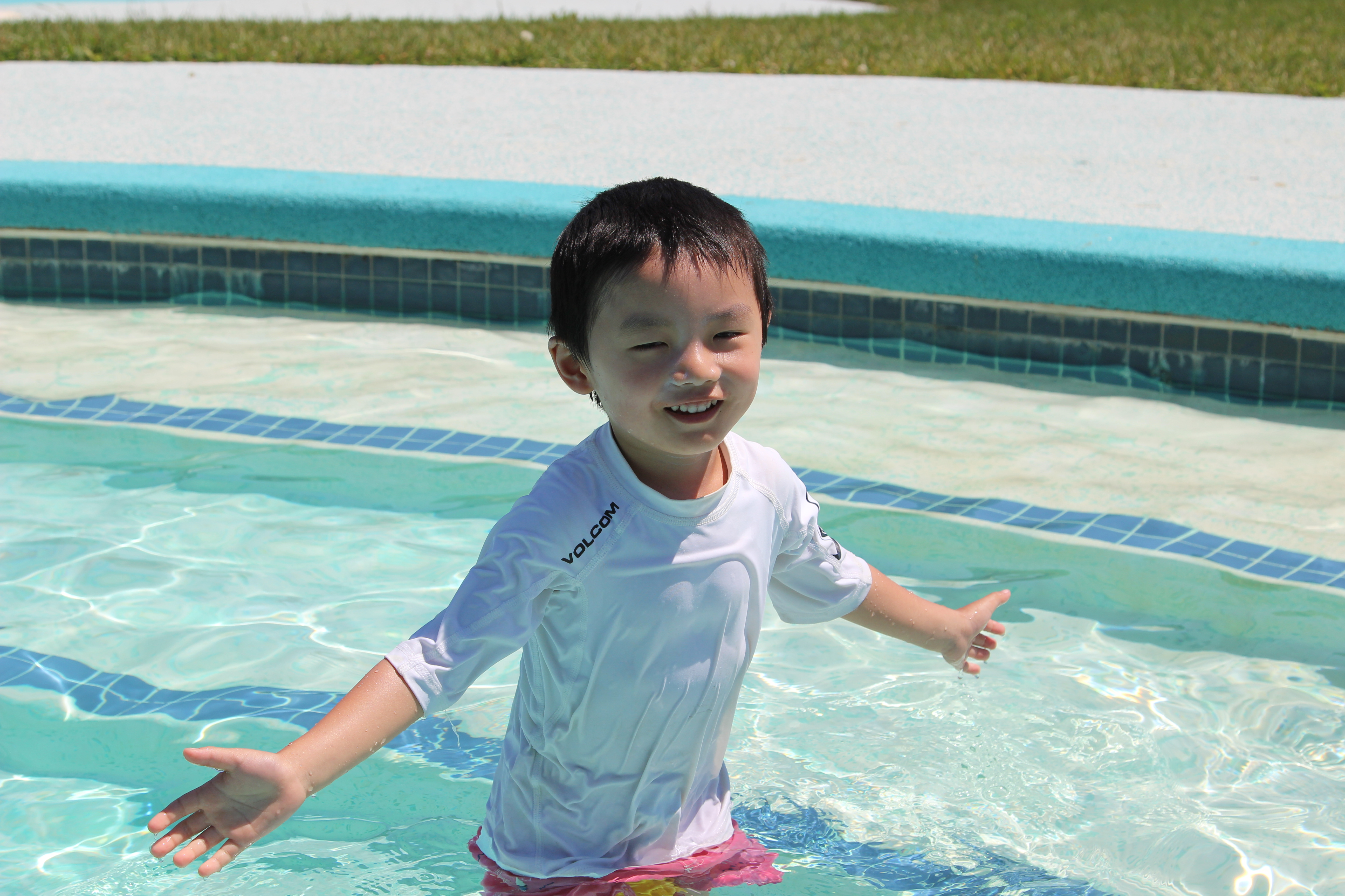 A new swimmer tries out the transitional steps in one of the 4 pools at Camp Robin Hood.